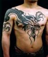 chinese dragon pic tattoo on chest of man